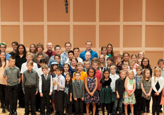 Student and teachers gathered onstage during Minnesota School of Music Bravo Concert Series